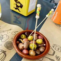 Free apettizer, delicious mix of olives at Porta Nuova - Pizzeria e Cucina Italiana in Premia De Mar