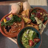 Mezze of mujadara with Moroccan olives, artichoke in oil with sun dried tomatoes, onion pickled in balsamic vinegar, and Italian olives, and guacamole with tequila.  at MEZZE in Granada
