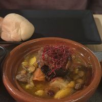 Morrocan tajine. Black bean spiced with black sausage spice with chickpeas , onion, raisins, carrots and tomatoes  at MEZZE in Granada