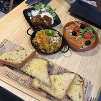 Garlic bread, rice, kofta, muhammara   at MEZZE in Granada