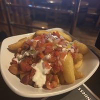Vegan house fries with different sauces and beans  at The Porterhouse in Dublin