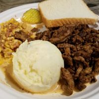 sit curls, corn, potato salad at BBQ Revolution in Austin