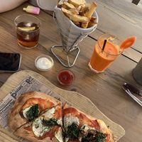 Vegan pizza and fries  at Golden Buddha in Ibiza