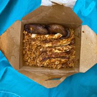 Jolof Rice bowl with plantain in box. at DF Nigerian Food Truck in New York City