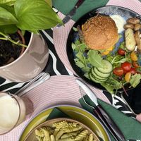 Pasta of the day (green pesto) & No chicken burger 🌞 - we can really recommend this place! For Coffee, Food & something sweet - really good, we came here everyday at lunch time! at Vegan Chouke in Brussels