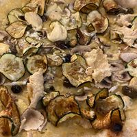 Crema di patate, funghi, chips di zucchine, olive taggiasche, hummus, scorza di limone at Bella Vita Pizzeria  in Asti