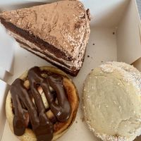 Chocolate Cake, “Nutella” cinnamon bun, something with caramell  at Pastelería Málaga Vegana in Malaga