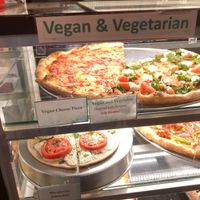 Vegan slices prominently displayed at iPizzaNY - Times Square in New York City