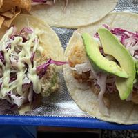 Fried avocado on the left and firecracker cauliflower on the right.   at Totally Taco in Roatan