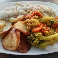 Ñoquis con papas asadas, brocoli y arroz. at 108 in Ljubljana