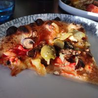 Perfect slice of wood fired Vegan Capri Pizza. at The Italian Sul Lago in Milton Keynes