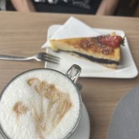 Veganer Cappuccino und veganer Käse-Mohn-Kuchen  at Cafe Jolie an der Donau in Regensburg