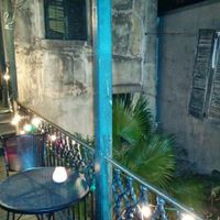 Dining area overlooking a nice courtyard to the side & below at Bhava in New Orleans