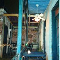 Dining area overlooking a nice courtyard to the side & below at Bhava in New Orleans