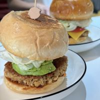 Burger - need request for diary free! Avocado burger infront. Behind is cheese burger (contain diary)  at Maluo - 阿媽家青稞地 素食 in Chengdu