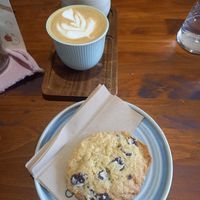 Coconut latte and vegan choc chip cookie at Noch Coffee Co in Dundee