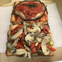 A slice of the eggplant and the mushroom  at Village Square Pizza in New York City