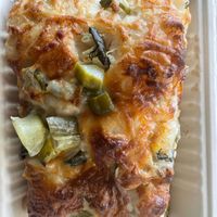 Dill pickle pizza focaccia  at Black Cat Vegan Bakery in Foley