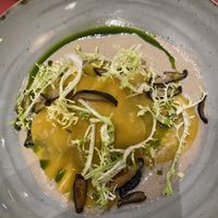 Open ravioli, mushroom cashew cream, sautéed mushrooms and spinach with frisée salad.  at Em Lume Brando in Budens