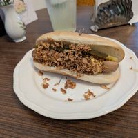 Hotdog mit Sauerkraut, BBQ Soße und Rostzwiebeln at Cafe Hibiskus in Cologne