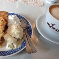 apple pie with whipped cream and vanilla ice cream (all vegan), plus oat cappuccino at Cafe Hibiskus in Cologne