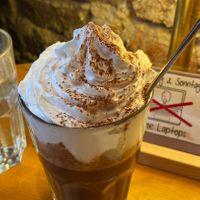 Dark hot chocolate with vegan cream  at Cafe Rotkehlchen - Venloer Str in Cologne