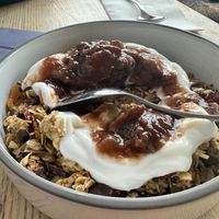 Vegan granola with coconut yoghurt and stewed fruit   at Brother Brew Cafe in Brighton