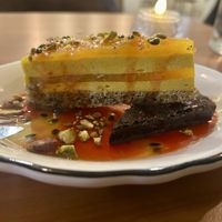 Partially frozen passion fruit dessert + brownie  at Hum Vegan in Montreal