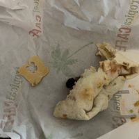Veggie and hummus wrap with the bread tie that was found in the middle of it  at Tropical Smootie Cafe in North Myrtle Beach