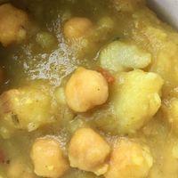 Vegan curry potatoes w chick peas  at Sunrise Caribbean in Washington