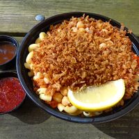 Akhnaton Bowl (Koshari)
Mixed rice, macaroni, and lentils topped with tomato sauce, crispy fried onions, side of our Daeh mixture of spiced garlic and vinegar. at King Tut - Egyptian Street Food in Brecksville