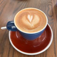 Oat milk small flat white  at Dot Com Cafe in Christchurch