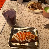 Smashed croissant with coconut cream and strawberry purée and blueberry shake at neon in Muenster