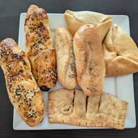 No pig on a blanket, pepperoni and cheese roll, spinach and tofucotta, peach turnover at SAU Bake in Hamilton