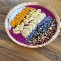 Dragonfruit based smoothie bowl with mango, banana, pineapple, coconut and mixed seeds  at The butterfly effect. in Chiang Mai