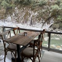 Tables overlooking the river  at KAYMANKA - Centenario de Machu Picchu in Aguas Calientes