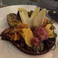 Shared dining tapas bakjes met veel humus en groenten   at FALLA in Arnhem