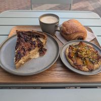 Quiche, chocolatine, and apricot pistachio tart at Land & Monkeys in Bordeaux