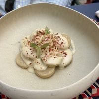 Gnocchi di sedano rapa con fonduta alle mandorle e polvere di peperone crusco  at Osteria della Gatta Matta in Parma