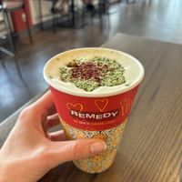 Kashmiri oat milk latte with pistachio & rose petals (caffeine free)  at Remedy Cafe - Jasper Ave in Edmonton