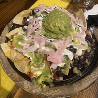 Vegan Loaded Nachos with added pickled onions  at Nacho Daddy - Downtown in Las Vegas