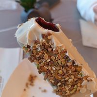 Black currant dipped it white chocolate and pistachio at Anjuna Ice Pops in Budapest