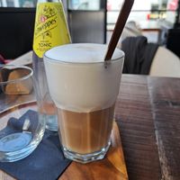 Latte macchiato with oat milk at Expo & Kafie  in Oostende