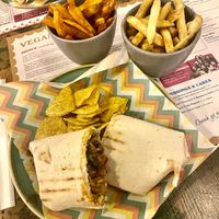 Sweetcorn and black bean burrito with fries and sweet potato fries  at Estadio Lounge in North West London