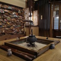 Entryway table woth votives on the wall at Shika-Jaya in Hakone