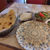 Palak channa (not on the menu) with vegan naan, rice and extra chili in the small cup. at Indian Bistro in Gothenburg