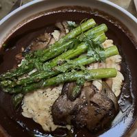 Mushroom steak with lemon orzo and asparagus.   at Le Basque in New York City