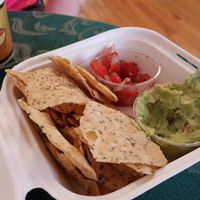 Freshly-made guacamole and nachos, a cup of soup in the background at Maize 'N' Manna Wholefoods in Westerly