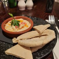 Flatbread and hummus - in the background soup of the day at Queens Hotel Brighton in Brighton