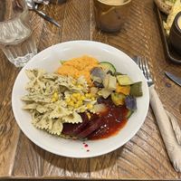 pesto pasta salad bowl with coconut milk latte  at The Deli Next Door in Elgin